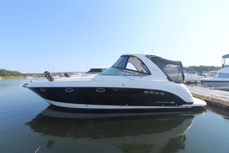 2008 Chaparral 350 Signature docked in calm waters.