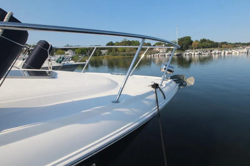The image shows the deck of a 2008 Chaparral 350 Signature, docked in a calm harbor.