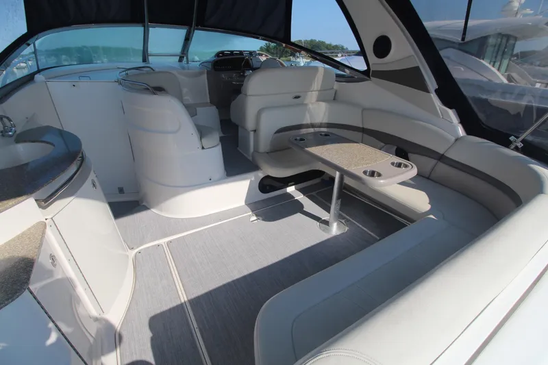Interior of a 2008 Chaparral 350 Signature with sleek seating and a table.