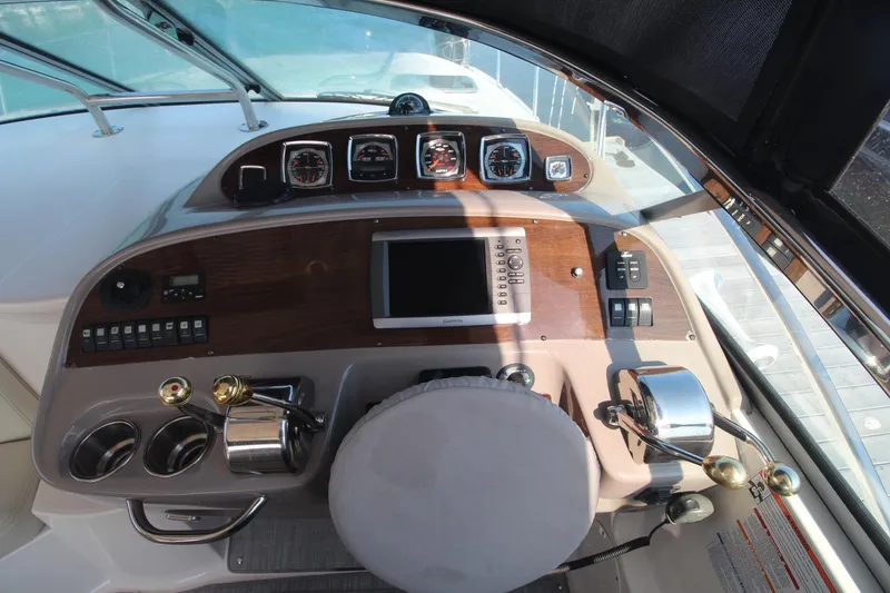 The 2008 Chaparral 350 Signature cockpit features a sleek dashboard with various instruments.