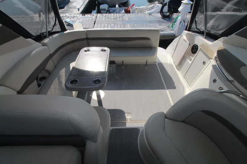 The image shows the cockpit of a 2008 Chaparral 350 Signature with seating and a table.