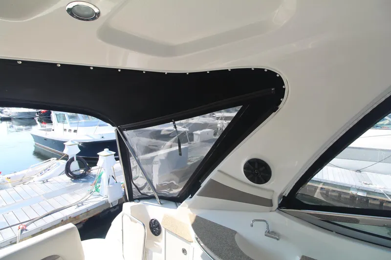 Interior view of a 2008 Chaparral 350 Signature with black trim and marina view.