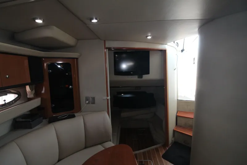 Interior of the 2008 Chaparral 350 Signature with cozy seating area and television.