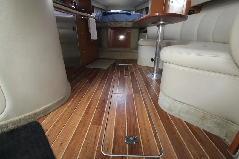 Interior of a 2008 Chaparral 350 Signature with wood flooring and beige upholstery.