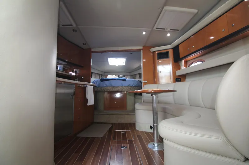 Interior of the 2008 Chaparral 350 Signature with elegant seating area and wooden flooring.