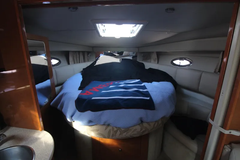 The cabin of the 2008 Chaparral 350 Signature features a cozy bed with skylights.