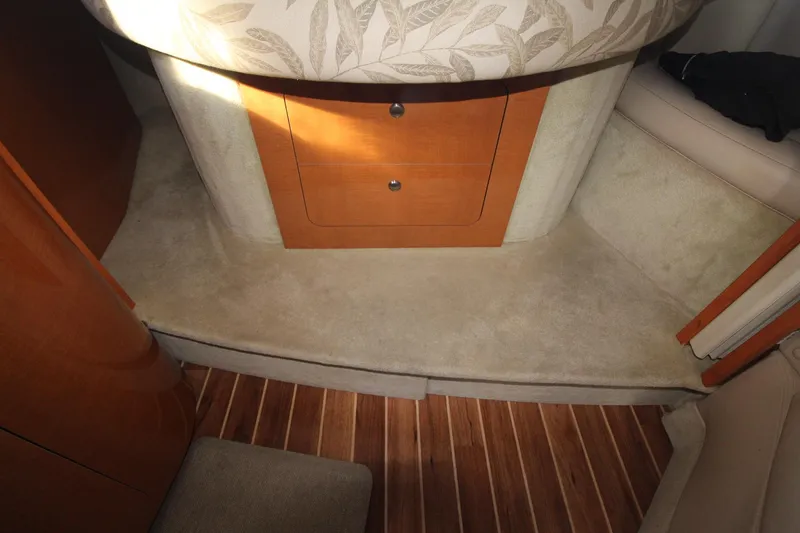 Interior of the 2008 Chaparral 350 Signature with wood flooring and drawers.