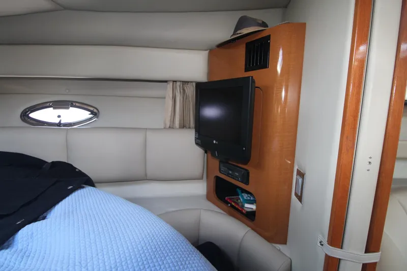 Interior of a 2008 Chaparral 350 Signature with a TV and porthole.
