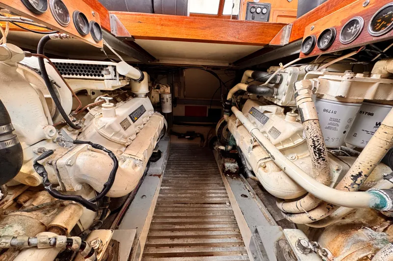 Engine room of a 1985 Symbol 51 yacht, featuring dual diesel engines.