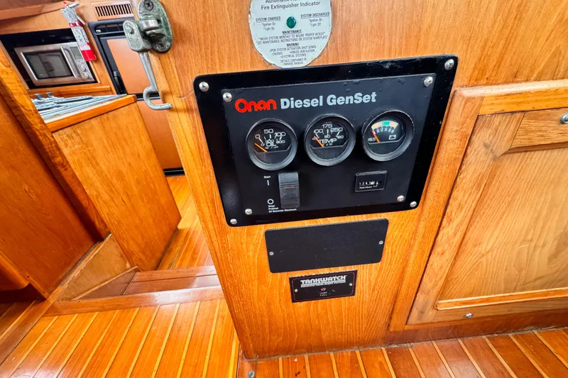 1985 Symbol 51 yacht interior with Onan Diesel GenSet control panel.