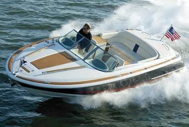 2004 Chris-Craft Corsair 25 boat cruising on water at high speed.