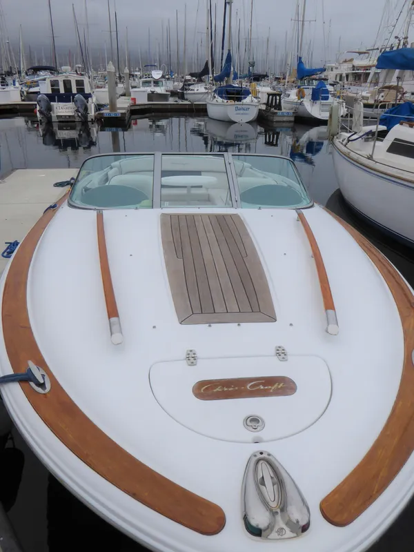 2004 Chris-Craft Corsair 25 boat docked in marina.