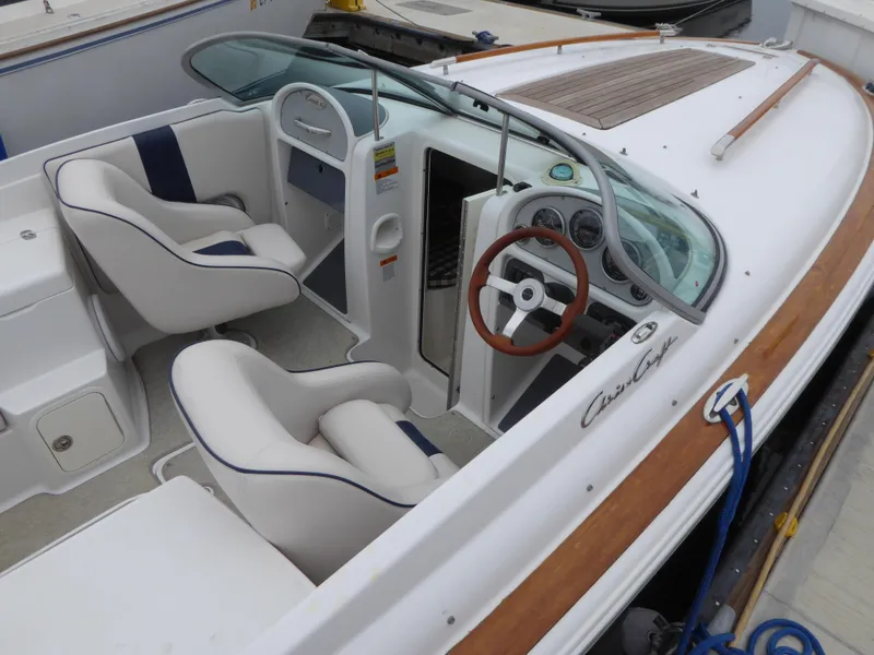 2004 Chris-Craft Corsair 25 boat with luxurious interior and wood accents.