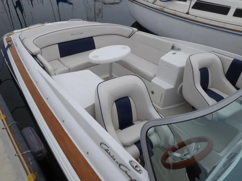 Interior of a 2004 Chris-Craft Corsair 25 boat with white seating.