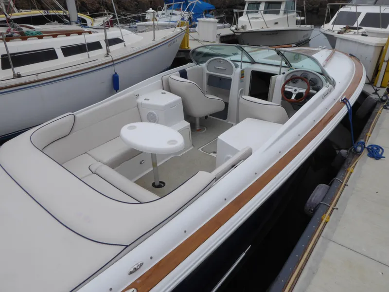 2004 Chris-Craft Corsair 25 boat docked, featuring sleek design.