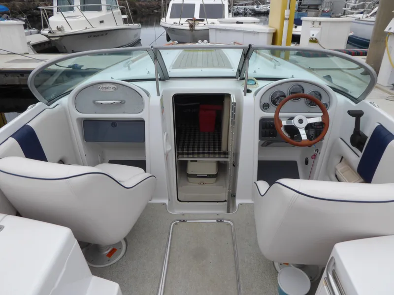 Interior of a 2004 Chris-Craft Corsair 25 with helm and seating.