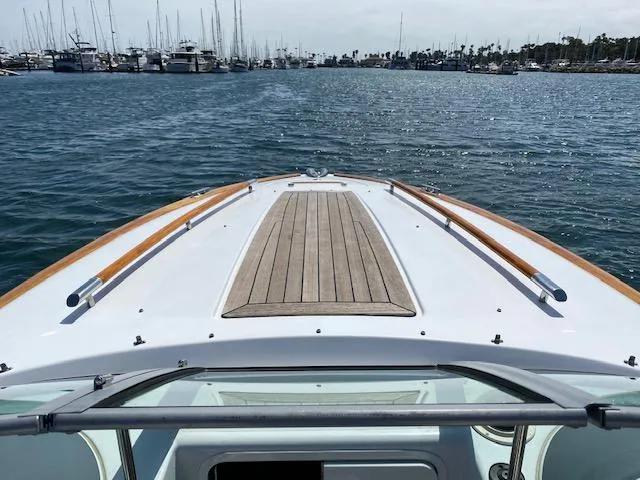 2004 Chris-Craft Corsair 25 on calm harbor waters.