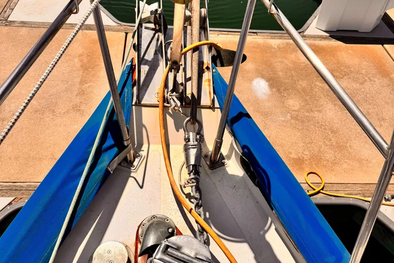 Deck view of 1982 Kelly Peterson 46 sailboat with ropes and anchor equipment.