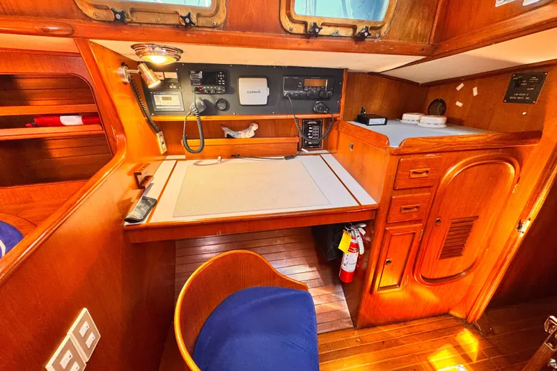 Nautical navigation station in 1982 Kelly Peterson 46 yacht with wooden interior and equipment.