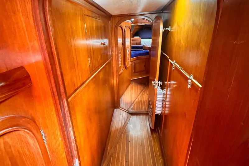 Interior of 1982 Kelly Peterson 46 yacht with wooden paneling and cozy cabin.
