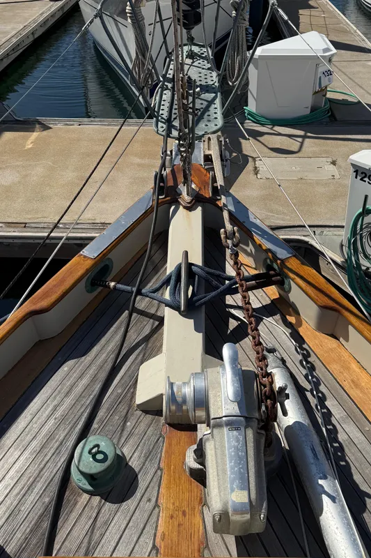 Historic 1932 Fellows & Stewart Yawl deck with anchor and mooring lines at marina.