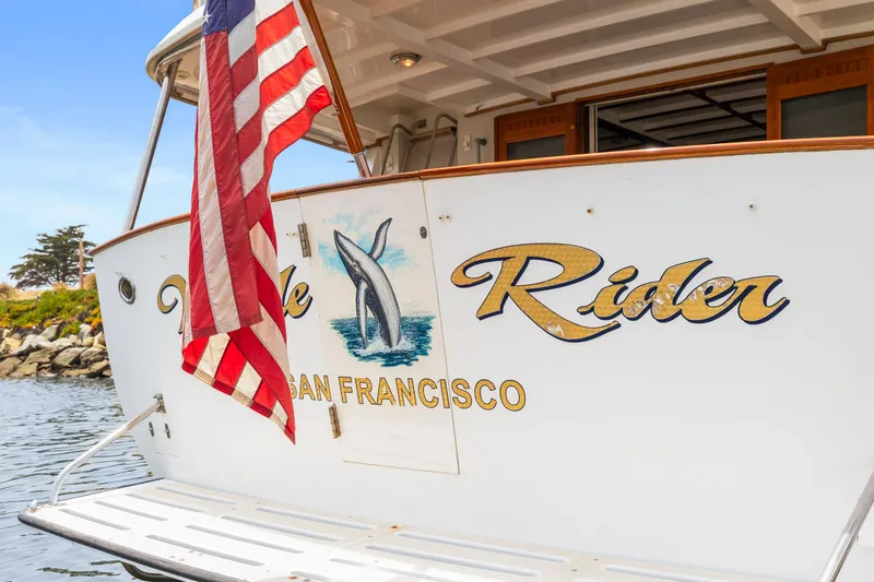 1996 Kadey-Krogen 48 Whaleback yacht with American flag, San Francisco.