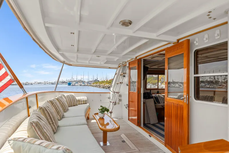 Luxurious 1996 Kadey-Krogen 48 Whaleback yacht with elegant interior and scenic marina view.