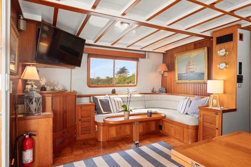 Luxurious 1996 Kadey-Krogen 48 Whaleback yacht interior with cozy seating and nautical decor.