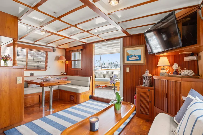 Luxurious 1996 Kadey-Krogen 48 Whaleback yacht interior with elegant wood finish and cozy seating.