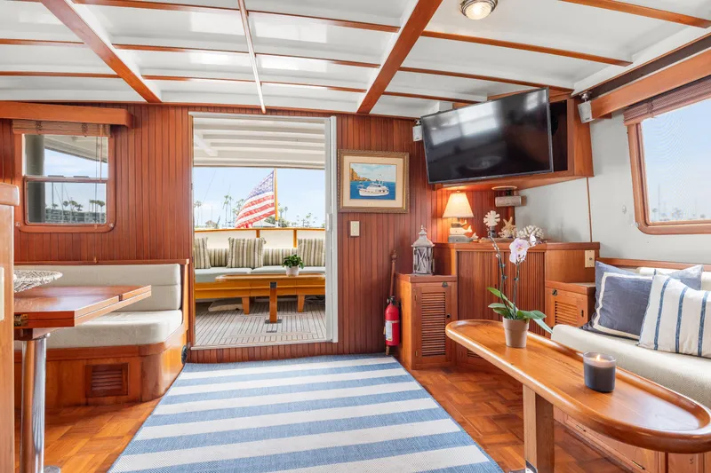 Interior of 1996 Kadey-Krogen 48 Whaleback yacht with cozy seating and nautical decor.