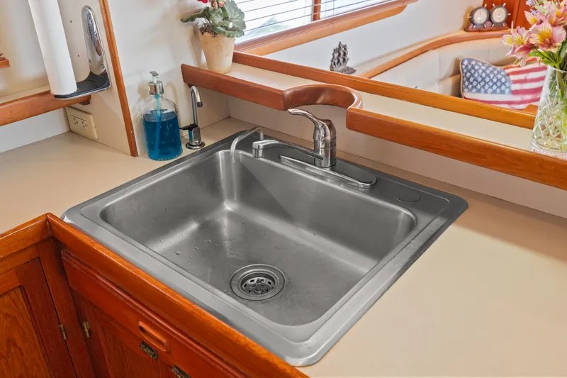Stainless steel sink in Kadey-Krogen 48 Whaleback yacht kitchen, 1996 model.