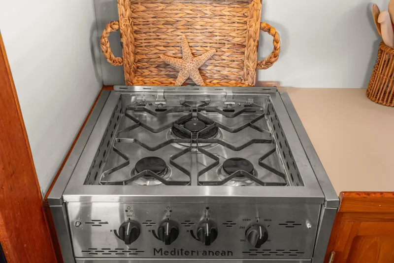Stainless steel stove in Kadey-Krogen 48 Whaleback yacht kitchen, 1996 model.