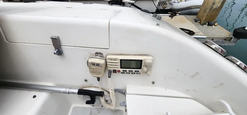 Control panel of a 1995 Catalina 42 MkII sailboat with radio and microphone.