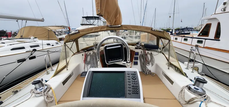 Cockpit view of a 1995 Catalina 42 MkII sailboat docked at a marina.