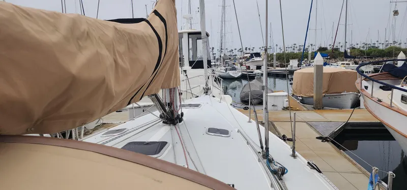 Sailboat docked at marina, Catalina 42 MkII, 1995 model, with covered sails.