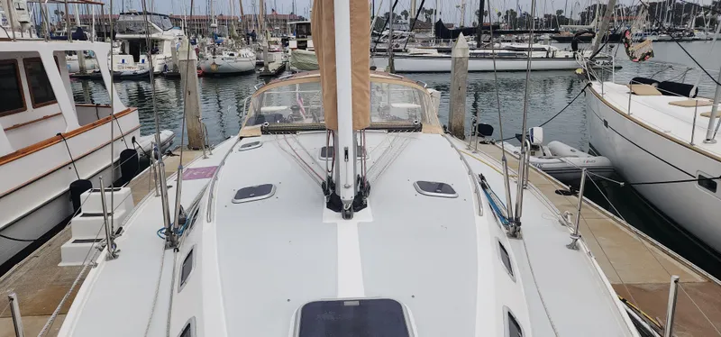 Sailboat Catalina 42 MkII, 1995 model, docked in a marina with other boats.
