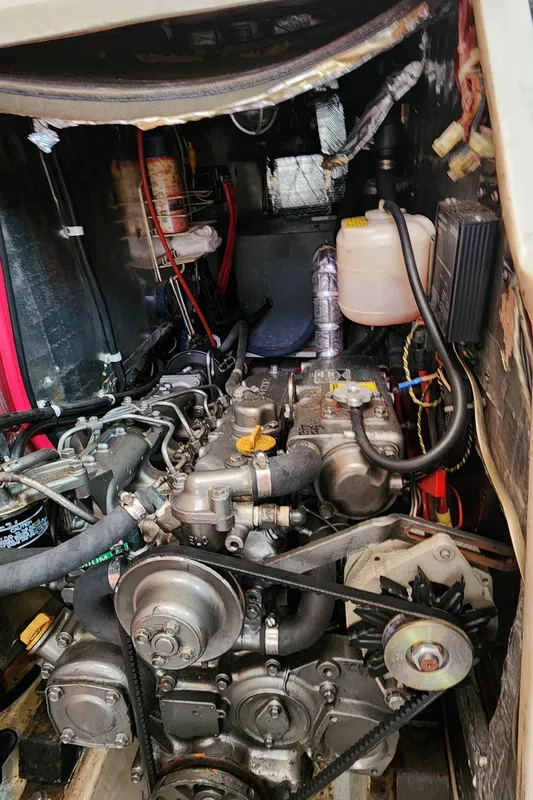 Engine compartment of a 1995 Catalina 42 MkII sailboat, showcasing mechanical components.