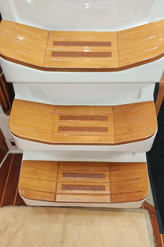 Wooden steps on a 1995 Catalina 42 MkII sailboat interior.