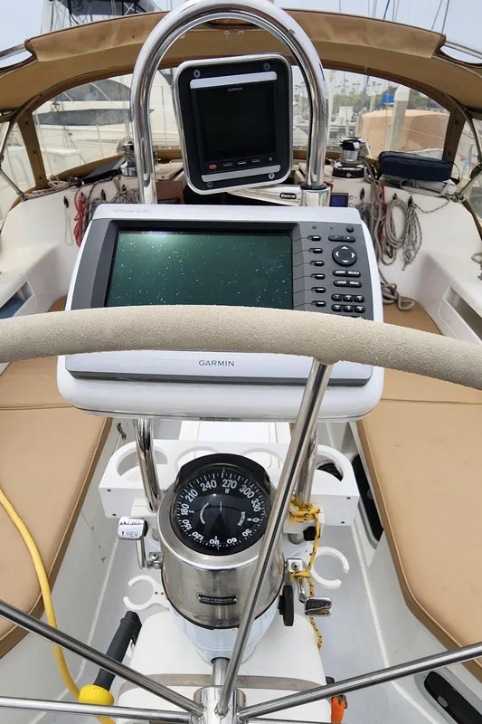 Cockpit of 1995 Catalina 42 MkII sailboat with navigation equipment and compass.
