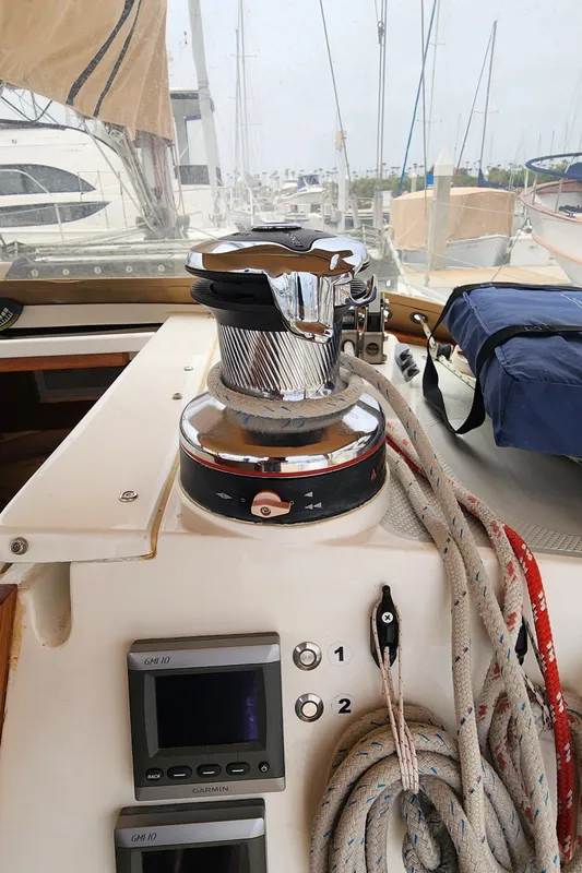 Sailboat deck of 1995 Catalina 42 MkII with winch and ropes.