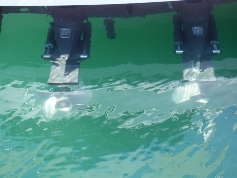 Twin propellers of a 2004 Formula 31 Performance Cruiser in water.