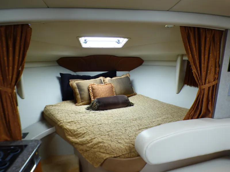 Interior of a 2004 Formula 31 Performance Cruiser with cozy bed.