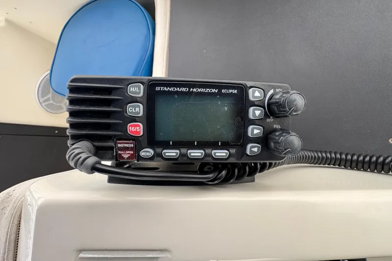 Marine radio on 1983 Hatteras 36 Convertible boat dashboard, Standard Horizon Eclipse model.