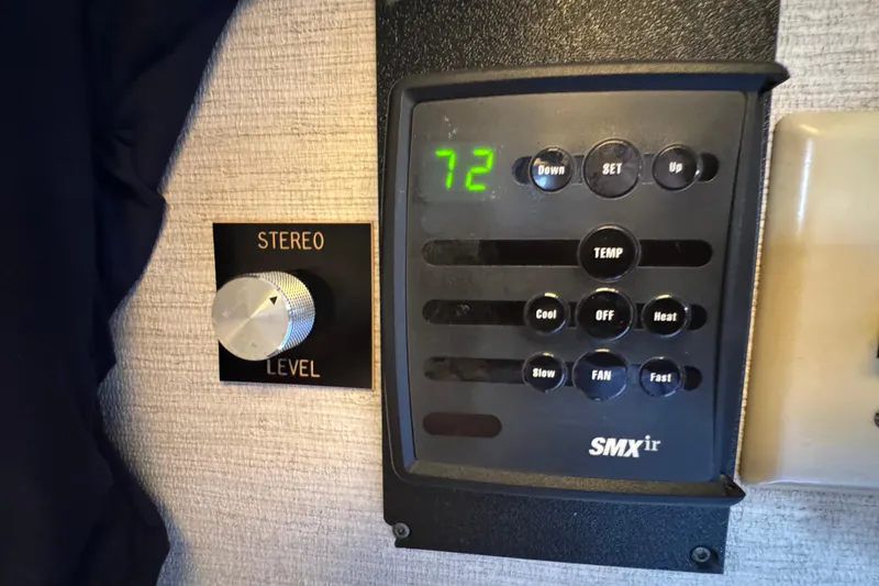 1983 Hatteras 36 Convertible stereo and climate control panel.
