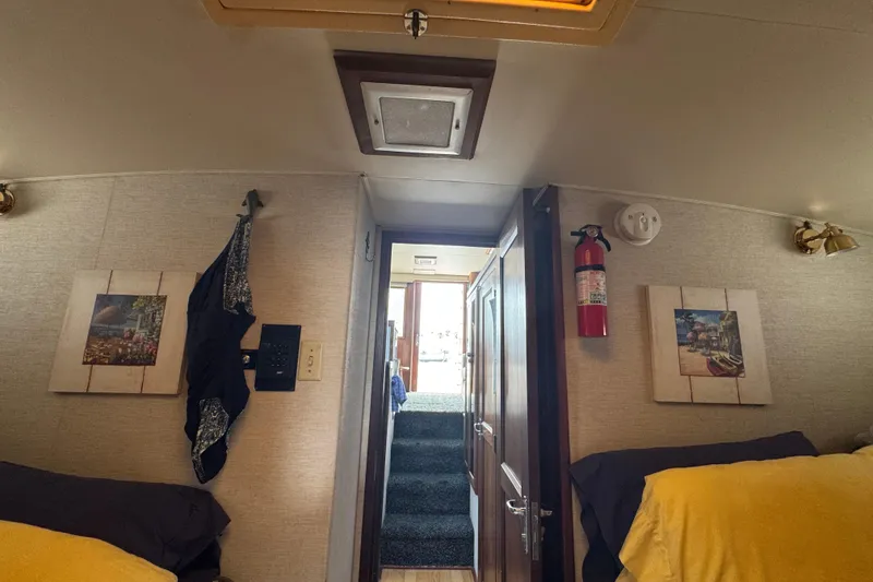 Interior of 1983 Hatteras 36 Convertible yacht with cozy cabin decor.