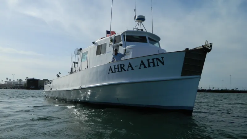 1958 Ditmar & Donaldson sport boat "AHRA-AHN" on water, clear sky background.