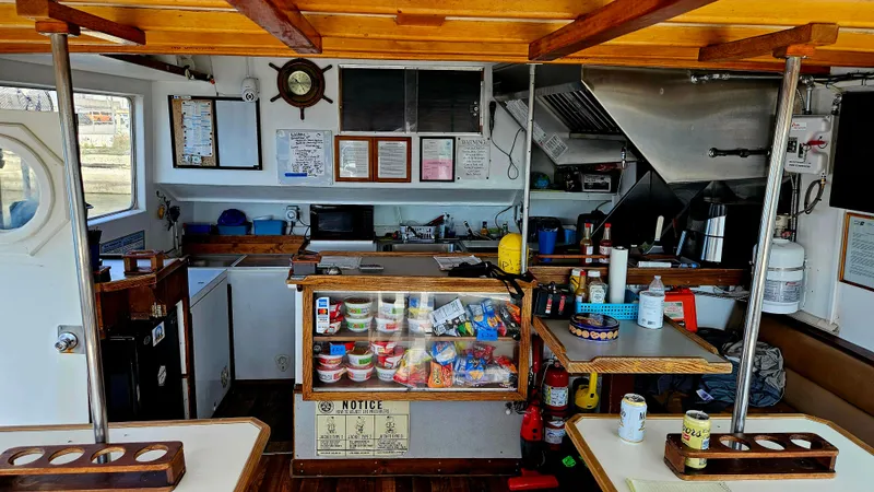 1958 Ditmar & Donaldson sport boat interior with kitchen and snack area.