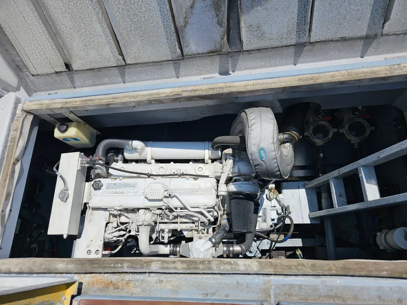 Engine compartment of a 1958 Ditmar & Donaldson Sport boat, showcasing mechanical components.