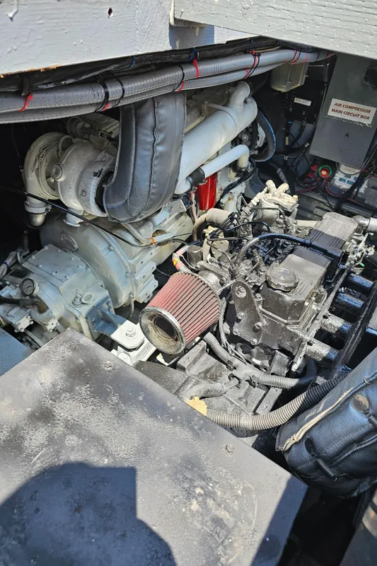 Engine compartment of a 1958 Ditmar & Donaldson Sport boat, showcasing mechanical components.