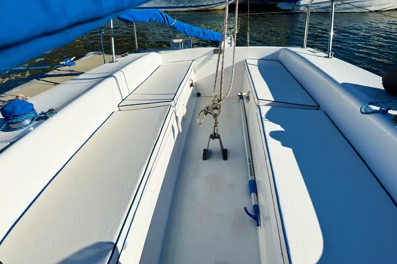 2002 Catalina 22 Capri sailboat interior with white seating and blue accents.